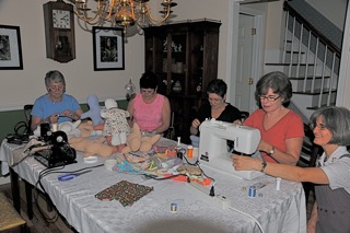 Hadassah women making dolls for Athens Regional Hospital patients